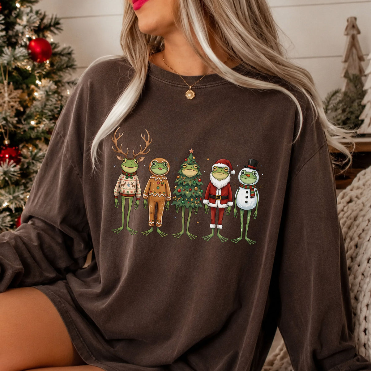 Five green frogs dressed as a reindeer in a Christmas sweater, gingerbread cookie, decorated Christmas tree, Santa and snowman, with snowflakes and stars.