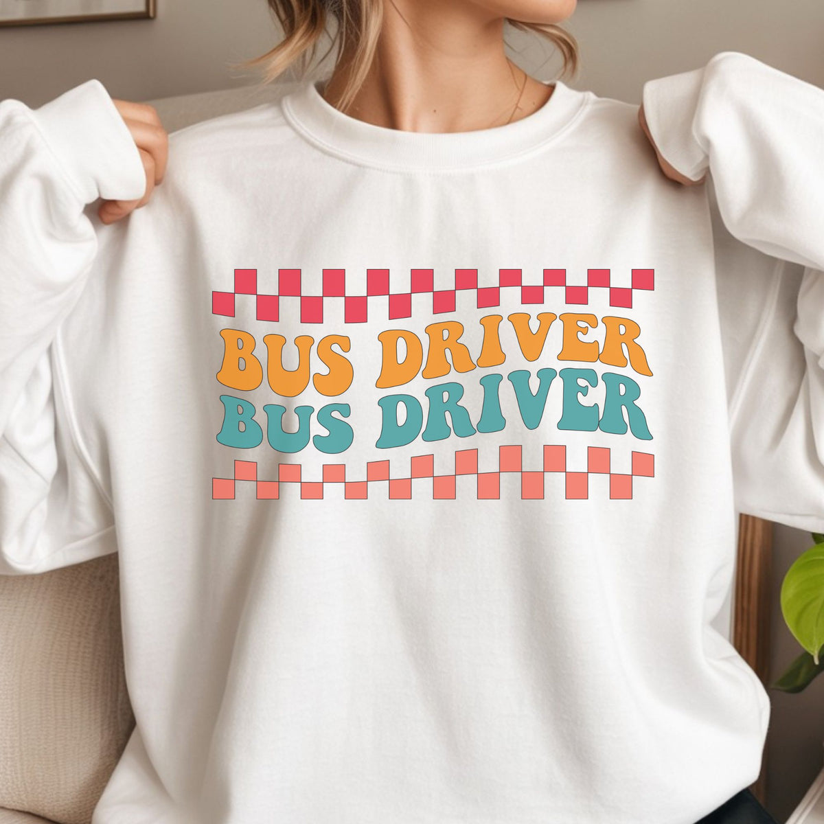 Retro Bus Driver design featuring repeated orange and teal lettering with coral and pink checkerboard borders in a bold vintage school transportation style.