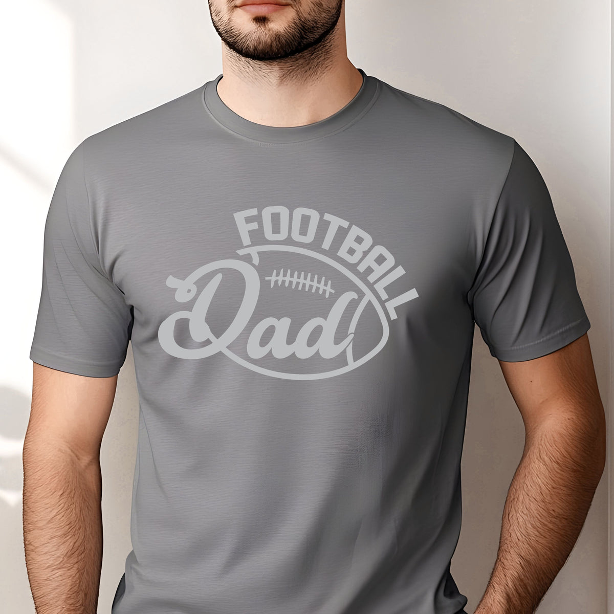 Football Dad DTF transfer featuring bold arched FOOTBALL lettering, large script Dad text, and a football lace accent in a clean monochrome sports design.