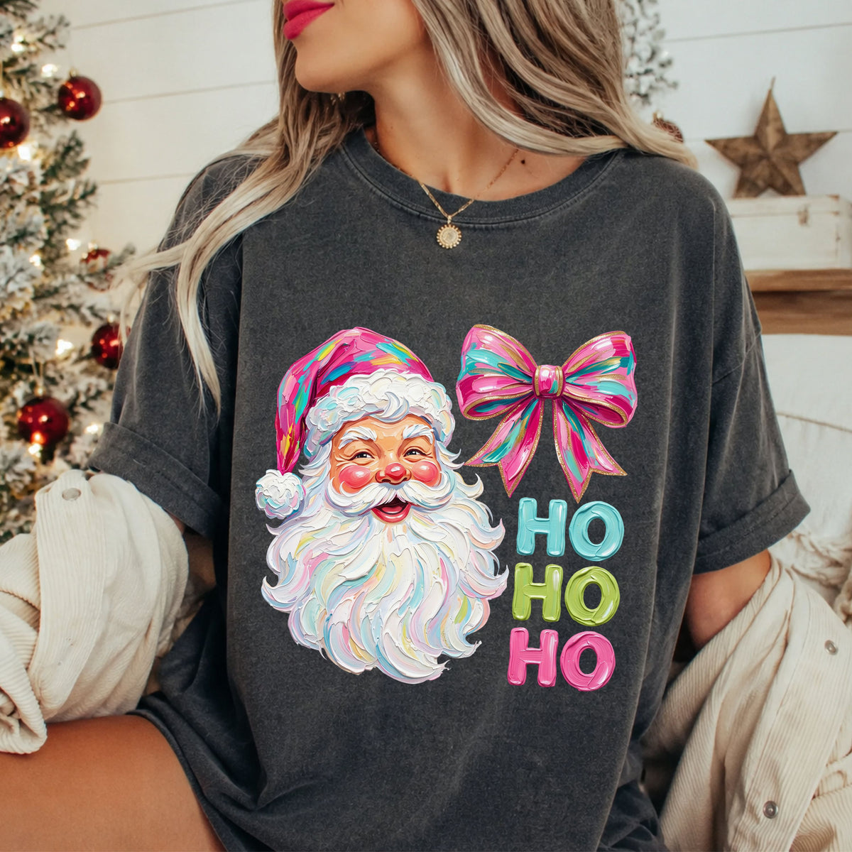 “Ho Ho Ho” in teal, lime green and pink beside a smiling Santa with a colorful pink hat, pastel beard and matching pink and teal bow with faux gold glitter trim.