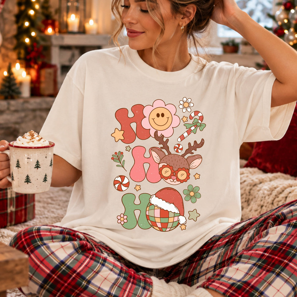 Ho Ho Ho stacked in coral, pink and sage letters with a pink smiley flower, reindeer wearing flower sunglasses and a disco ball in a Santa hat, surrounded by peppermint candy, flowers and stars.