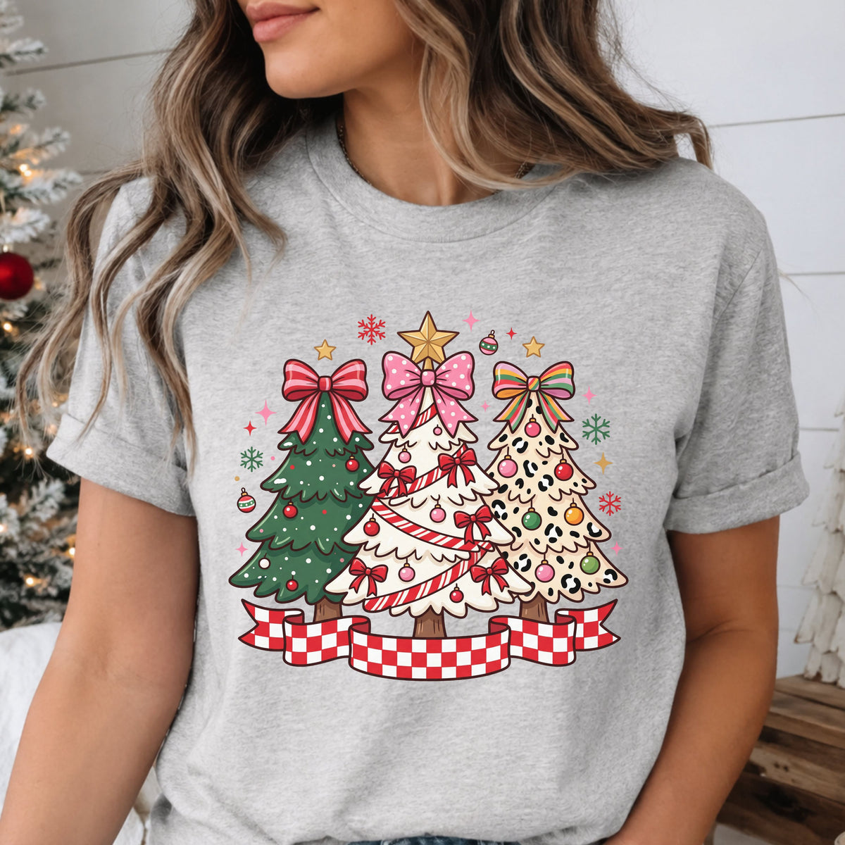 Three Christmas trees featuring green branches, candy cane garland and tan leopard print, topped with red striped, pink polka dot and rainbow bows above a red and white checkered banner.