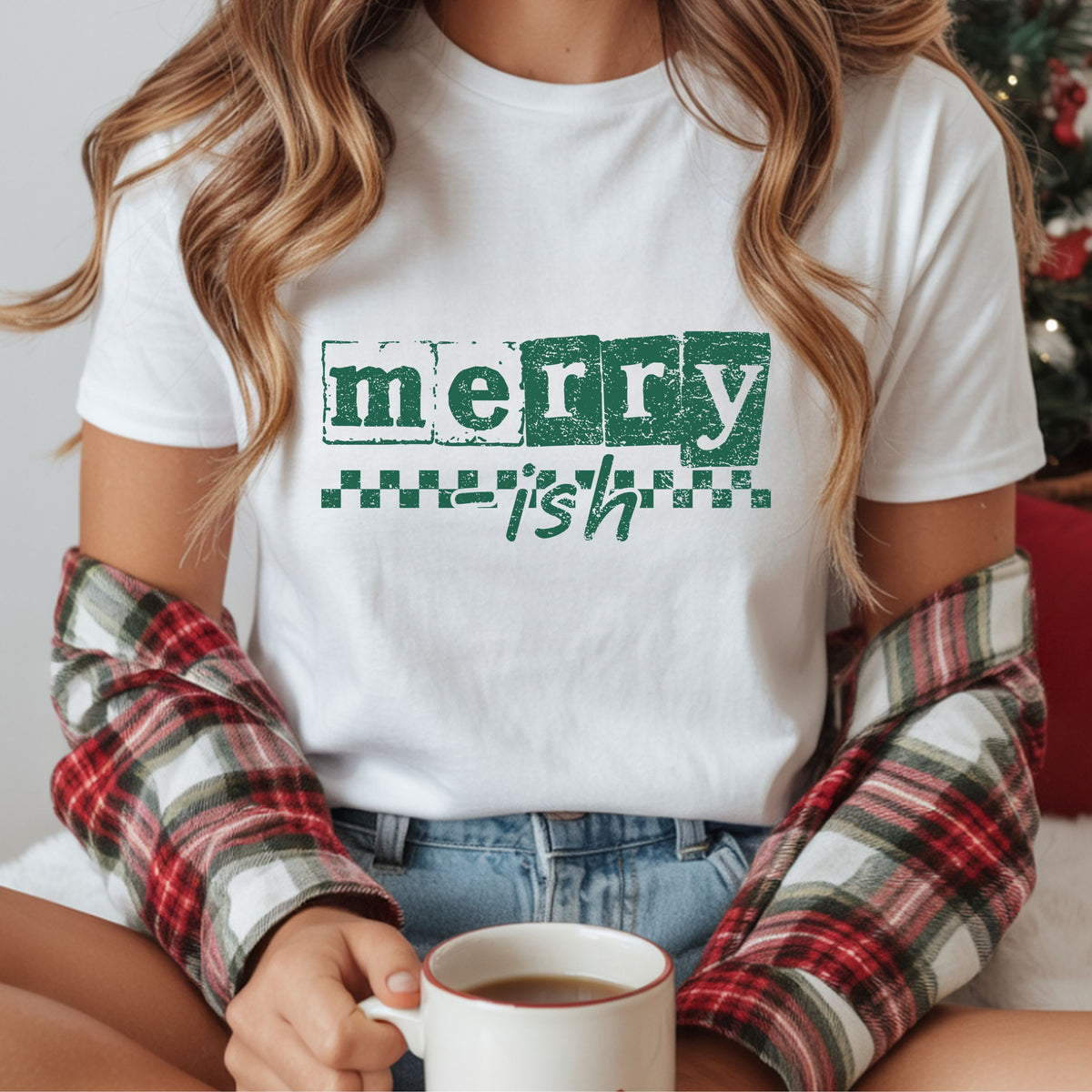 “Merry-ish” in distressed green letter blocks and handwritten script, with a green checkerboard stripe beneath the block lettering.