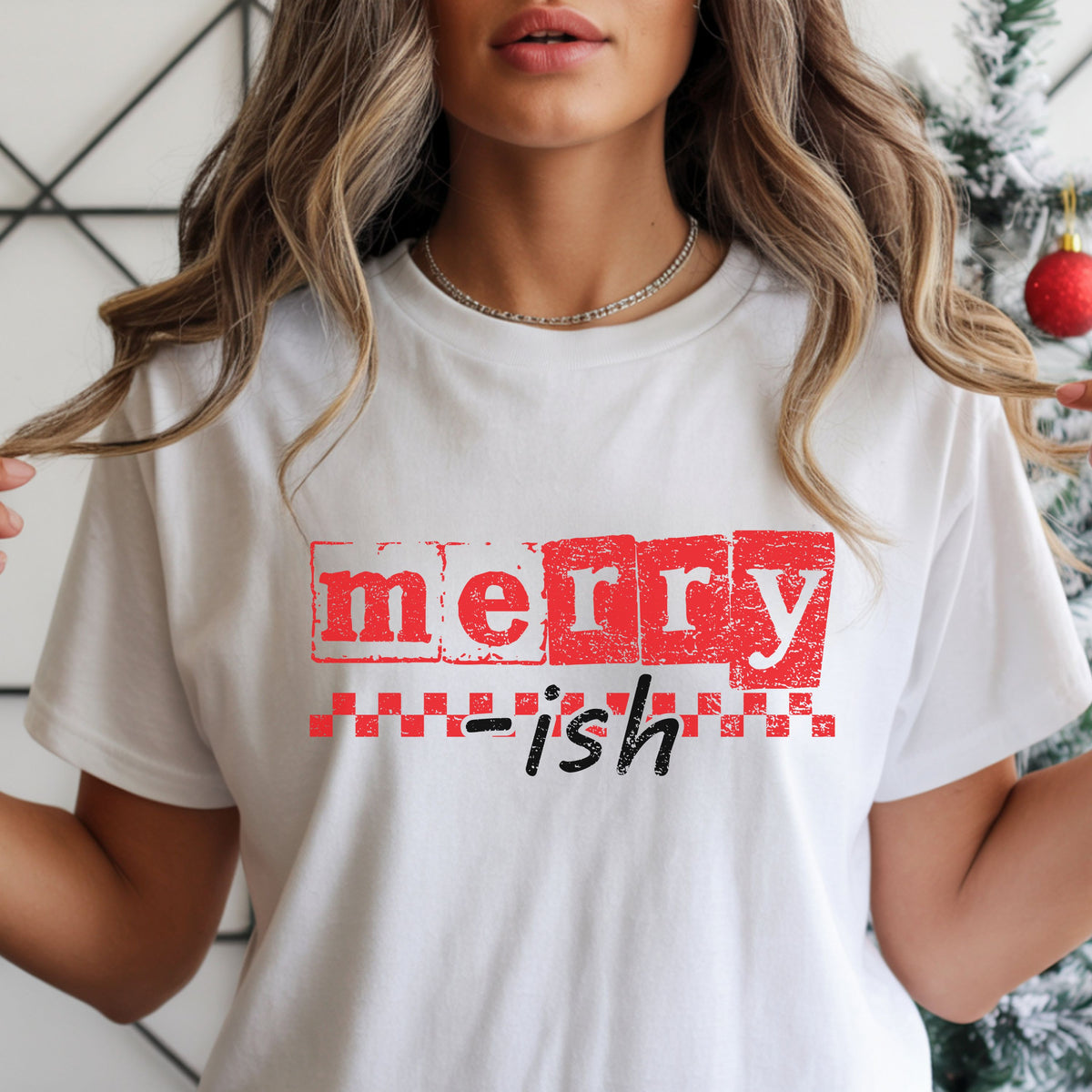 “Merry-ish” in distressed red letter blocks and black script, with a red checkerboard stripe beneath the block lettering.