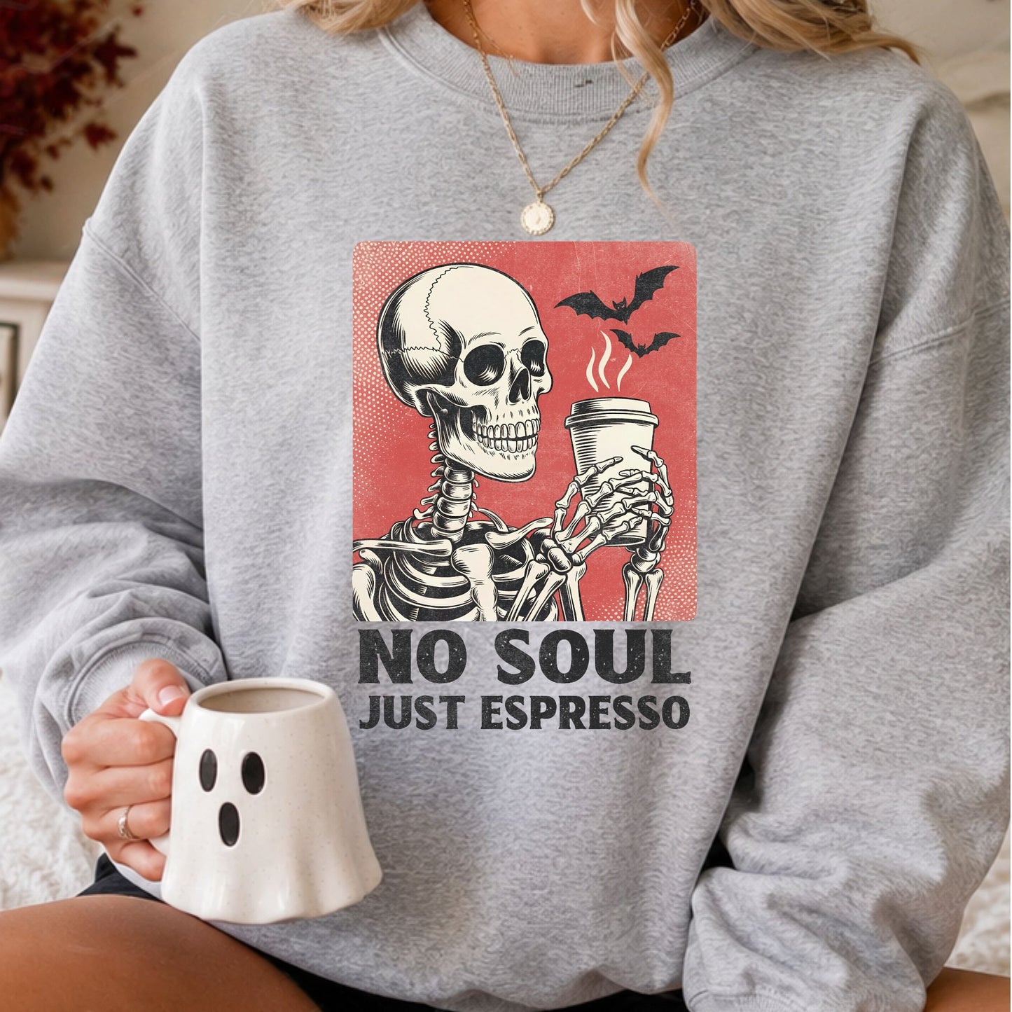 No Soul, Just Espresso Halloween DTF transfer featuring a vintage-style skeleton holding a steaming takeaway coffee cup with flying bats, a distressed red background and bold black lettering on a gray sweatshirt mockup.