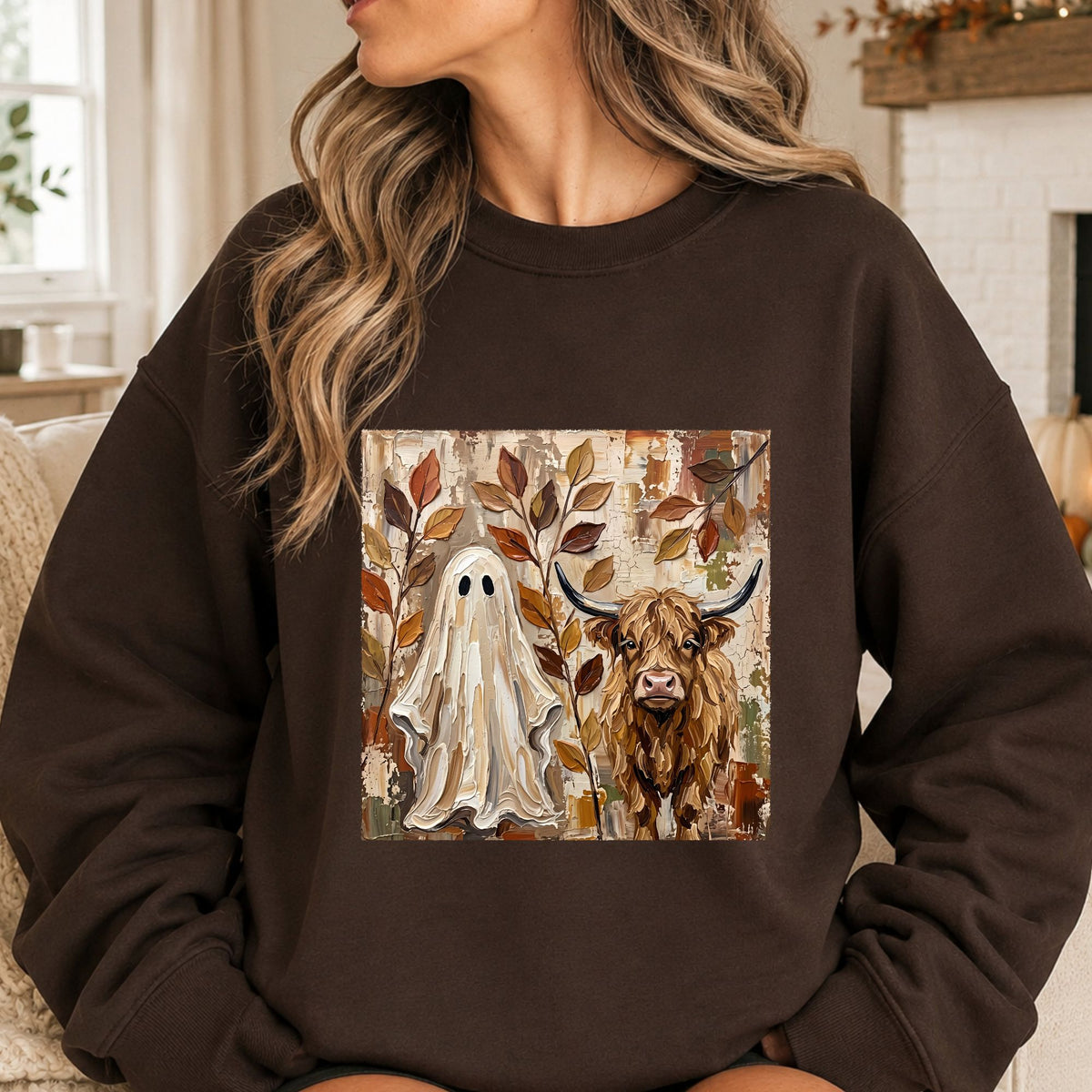 Painted brushstroke Halloween DTF transfer featuring a white ghost beside a shaggy Highland cow surrounded by rustic autumn leaves in warm brown, tan, cream, and muted fall tones.