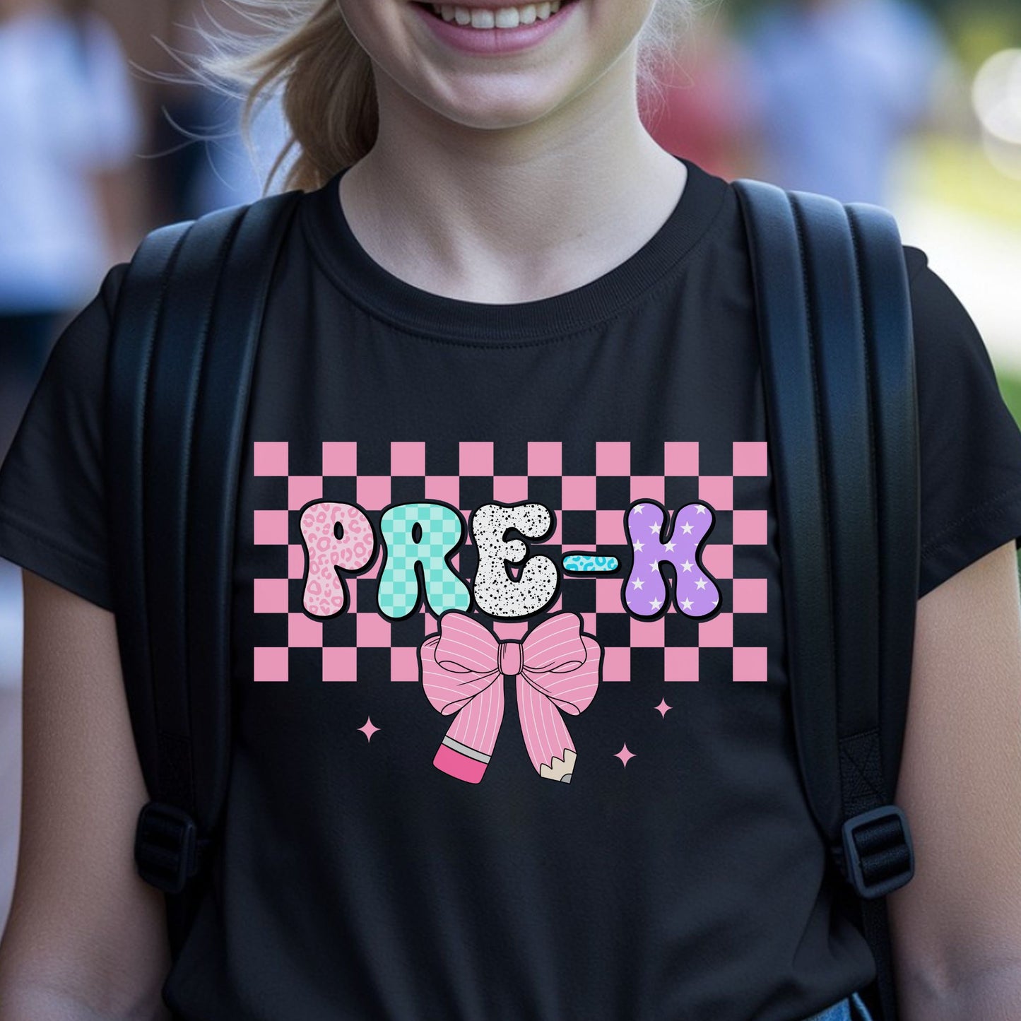 Pre-K back-to-school design featuring colorful patterned bubble letters, a pink checkerboard background, pencil bow, sparkles, leopard print, stars, and playful preschool style.