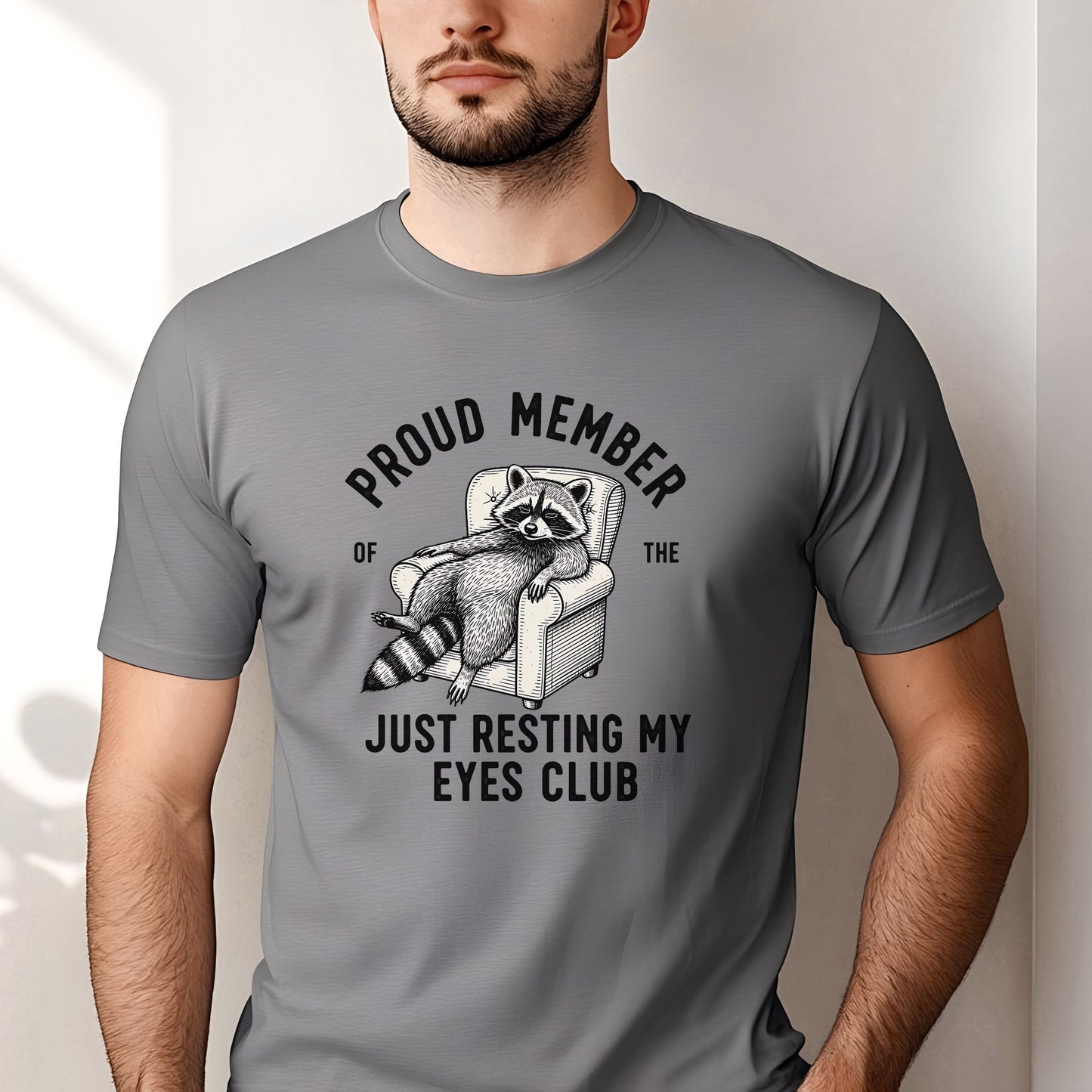 Funny raccoon lounging in a chair with the phrase Proud Member of the Just Resting My Eyes Club, perfect for tired parents, nap lovers, sleepy people, and sarcastic humor fans