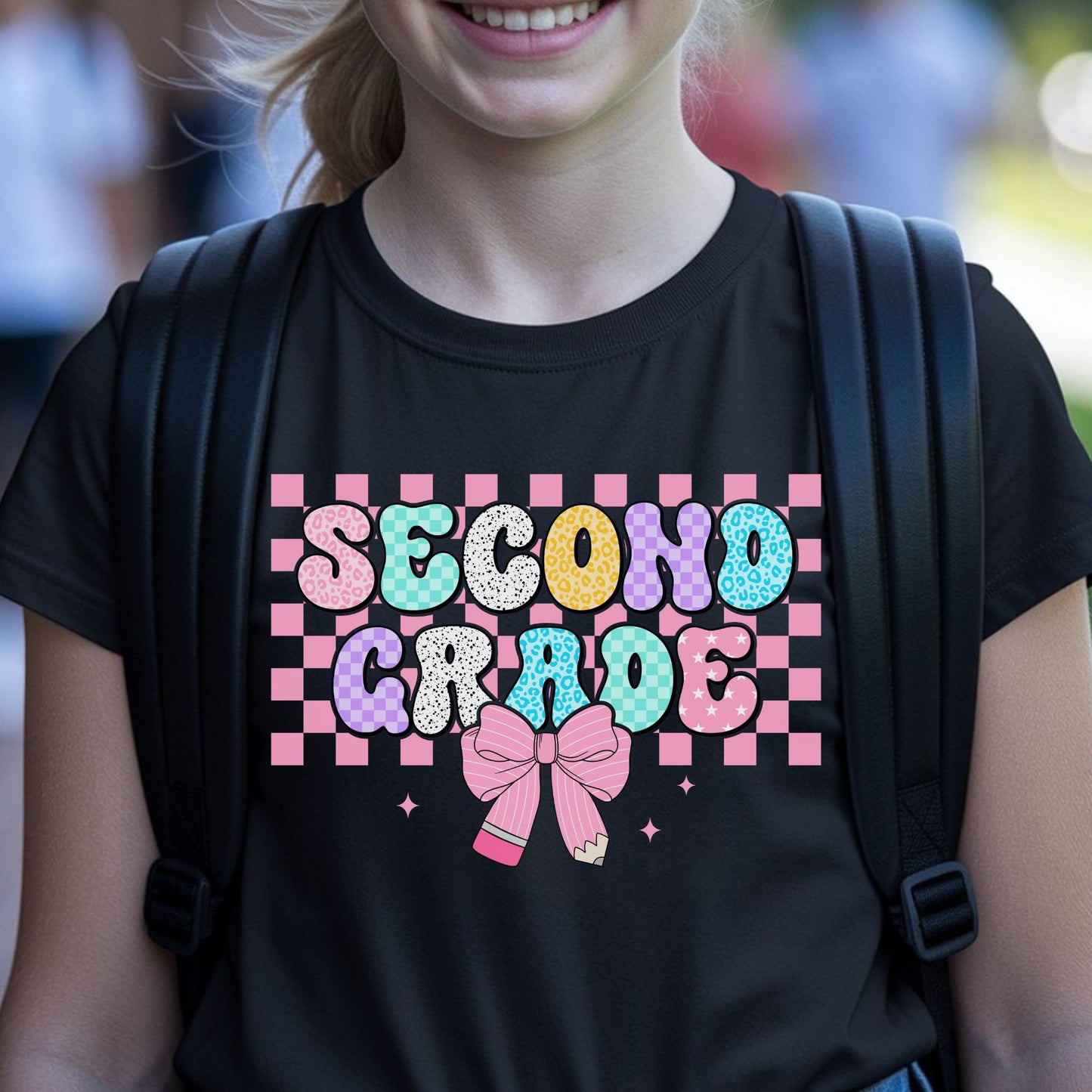 Second Grade back-to-school design featuring colorful patterned bubble letters, a pink checkerboard background, pencil bow, sparkles, leopard print, stars, and playful classroom details.