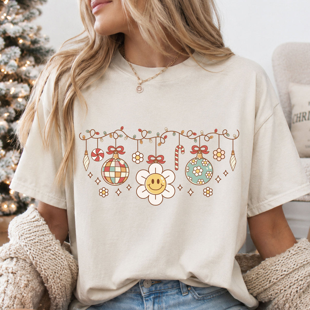 Retro Christmas garland with string lights, a disco ball, smiling daisy, floral ornament, bows, candy cane and peppermint in muted red, sage, yellow and cream.