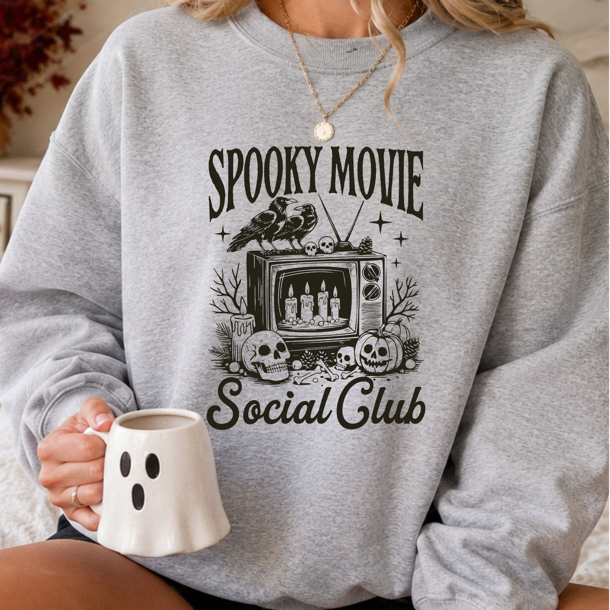 Spooky Movie Social Club Halloween DTF transfer featuring a vintage television, ravens, skulls, candles and jack-o-lantern pumpkin in a black retro horror style