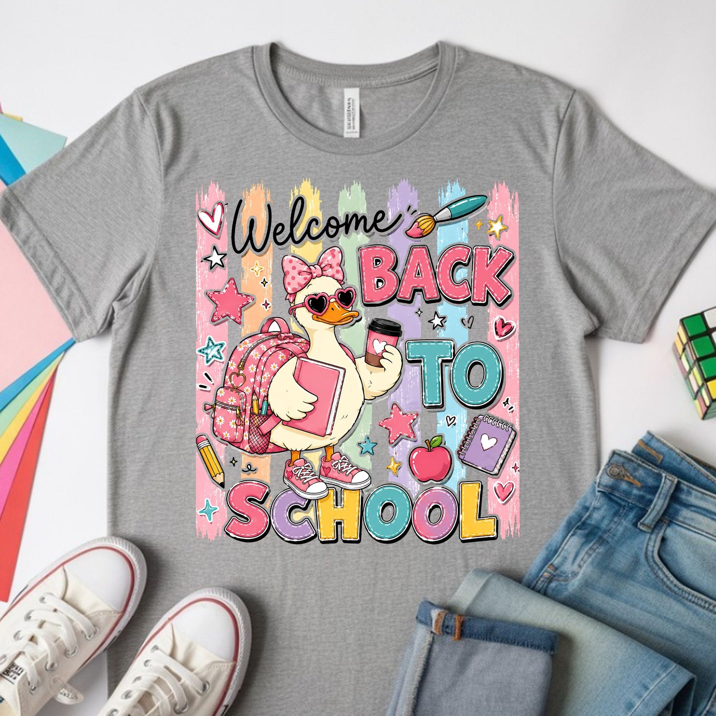 Cute welcome back to school goose wearing a pink bow, heart sunglasses, backpack, sneakers, and holding school supplies with colorful pastel classroom graphics.