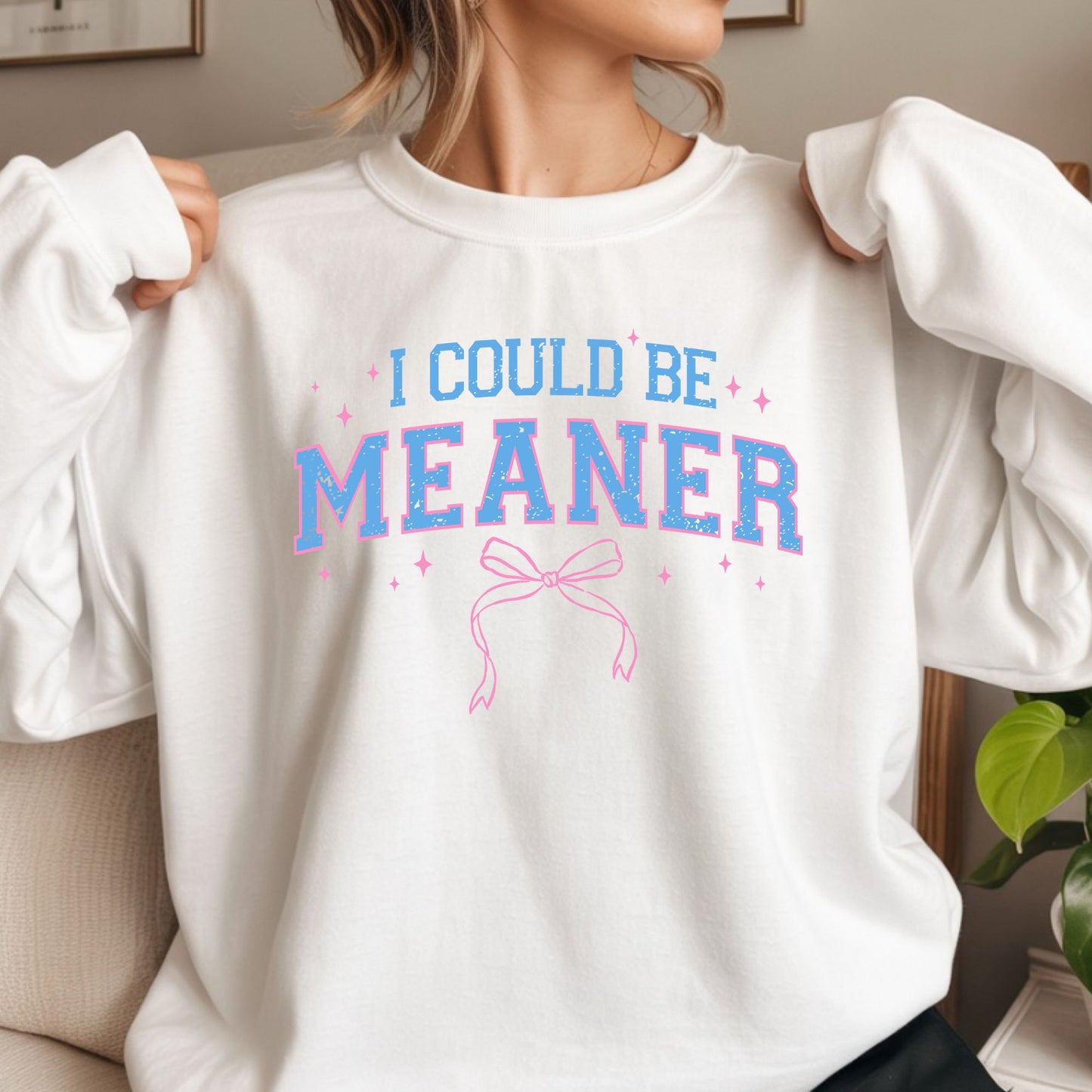 Coquette style I Could Be Meaner DTF transfer with pink bow, blue varsity lettering, and sparkles