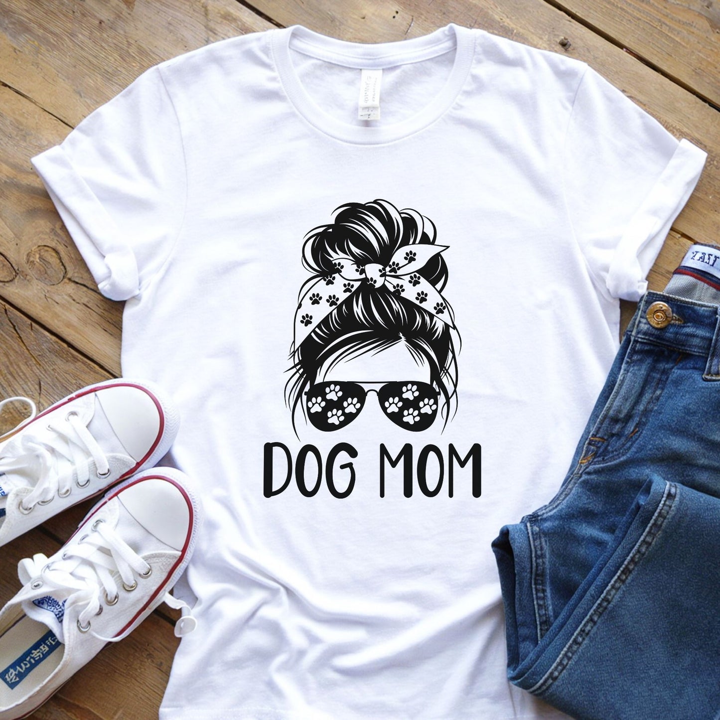 Dog mom graphic with messy bun sunglasses and paw print bandana design on white t-shirt mockup ready to press DTF transfer