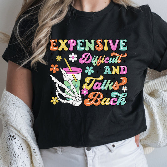 Colorful expensive difficult and talks back DTF transfer with retro lettering, skeleton hand, flowers, and drink cup