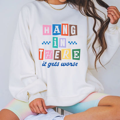 Funny Hang In There It Gets Worse graphic featuring colorful ransom-style letters, retro colors, and sarcastic humor design