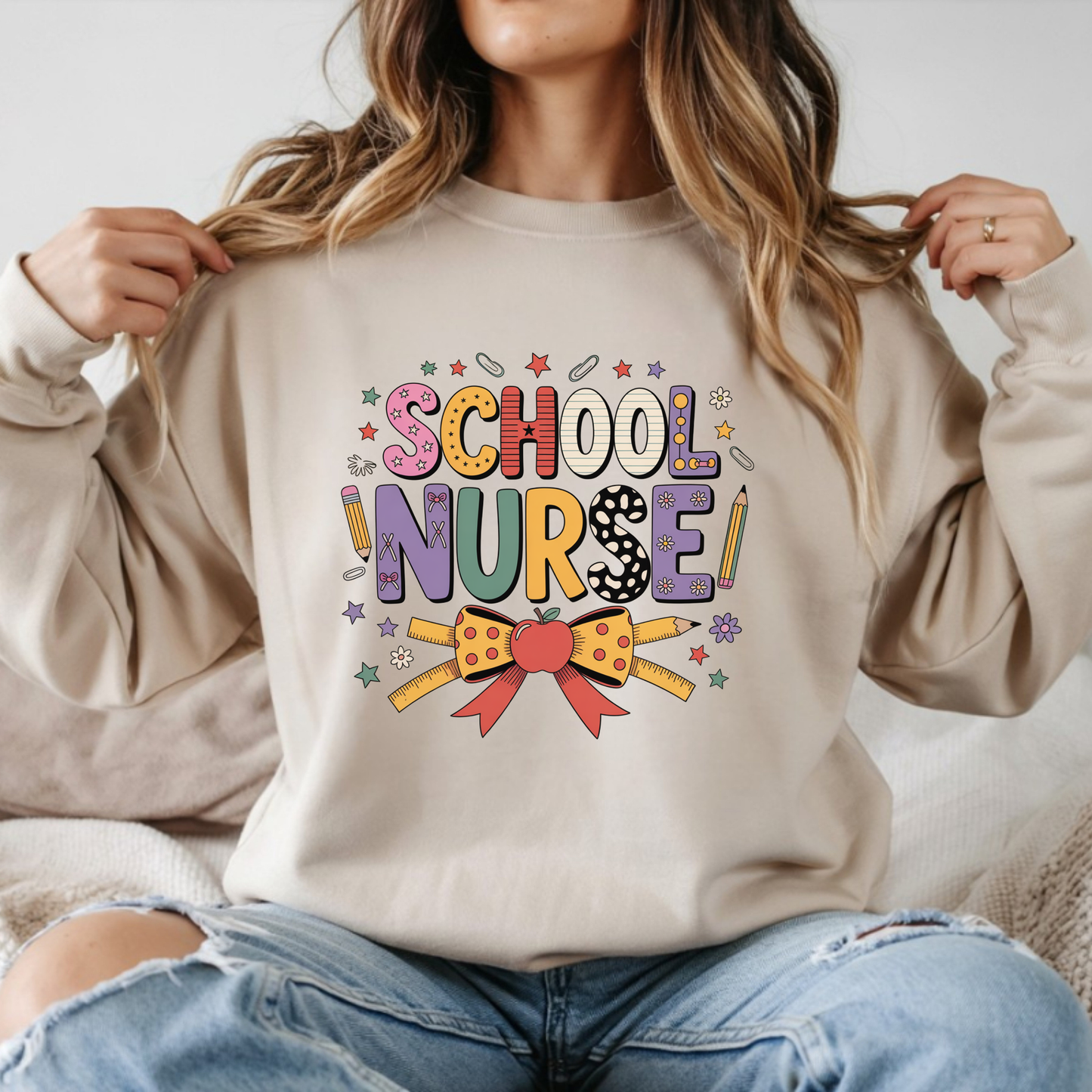 School nurse colorful graphic with bow pencils and apple design on sweatshirt mockup ready to press DTF transfer