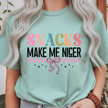 Funny Snacks Make Me Nicer graphic with colorful retro lettering, pink bow, and checker accents