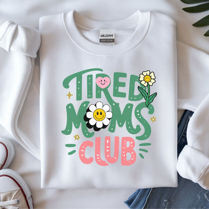 Tired moms club DTF transfer with smiley daisy flowers, playful retro lettering, and cute mom aesthetic