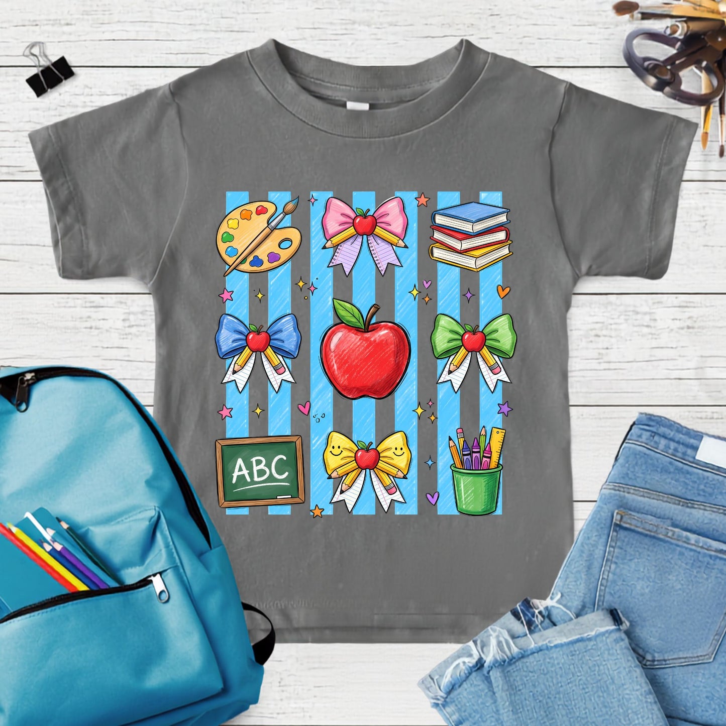 Colorful back-to-school design featuring an apple, pastel bows, books, paint palette, chalkboard, pencils, crayons, ruler, and classroom supplies on blue stripes.