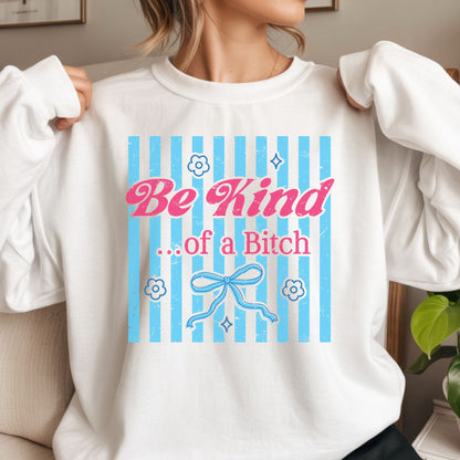 Funny coquette-inspired graphic with blue stripes, pink lettering, bow accents, and the phrase "Be Kind...of a Bitch." Trendy sarcastic design for graphic tees, hoodies, and boutique apparel.
