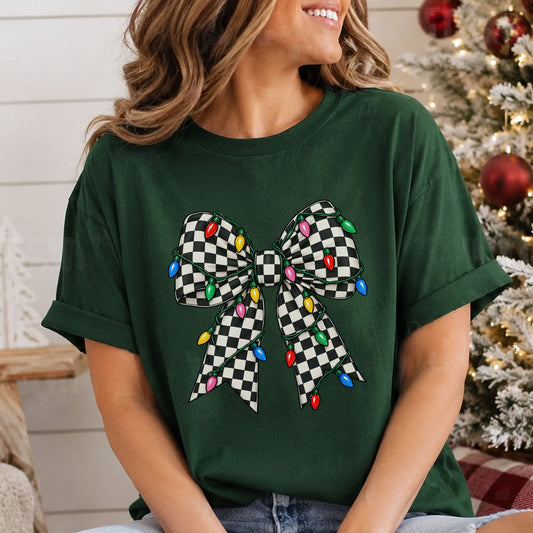Black and white checkerboard ribbon bow wrapped in a green string of red, pink, yellow, blue and green Christmas lights.