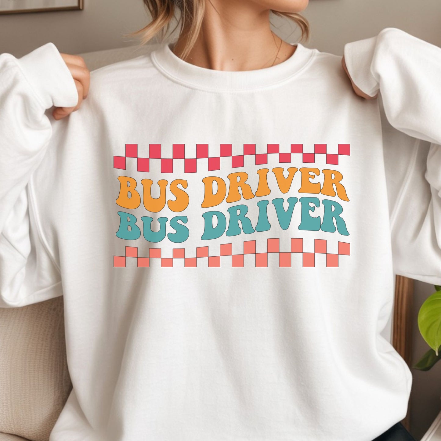 Retro Bus Driver design featuring repeated orange and teal lettering with coral and pink checkerboard borders in a bold vintage school transportation style.