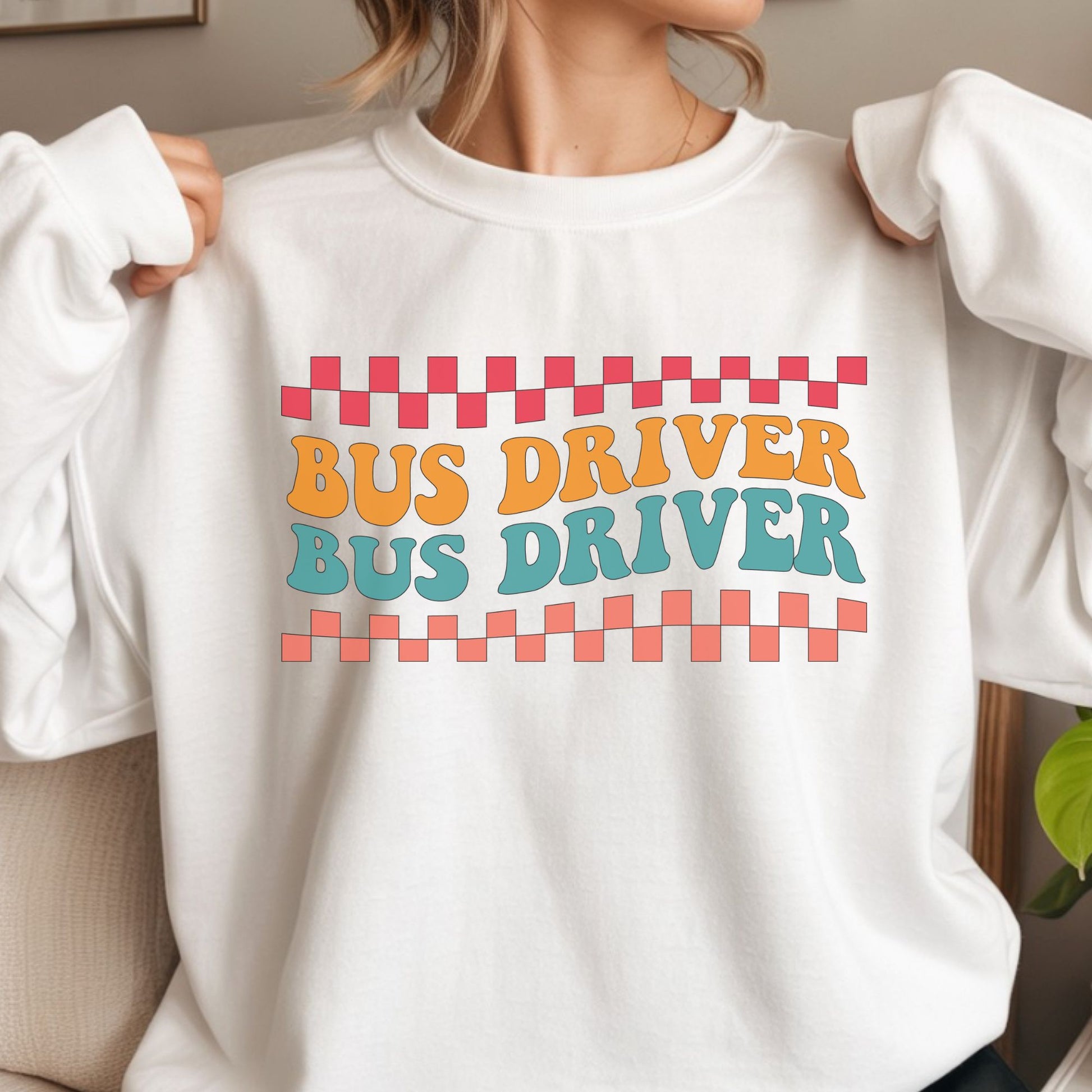 Retro Bus Driver design featuring repeated orange and teal lettering with coral and pink checkerboard borders in a bold vintage school transportation style.
