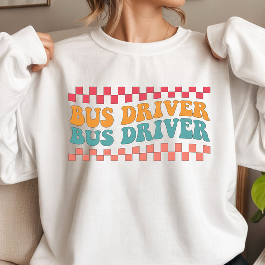 Retro Bus Driver design featuring repeated orange and teal lettering with coral and pink checkerboard borders in a bold vintage school transportation style.