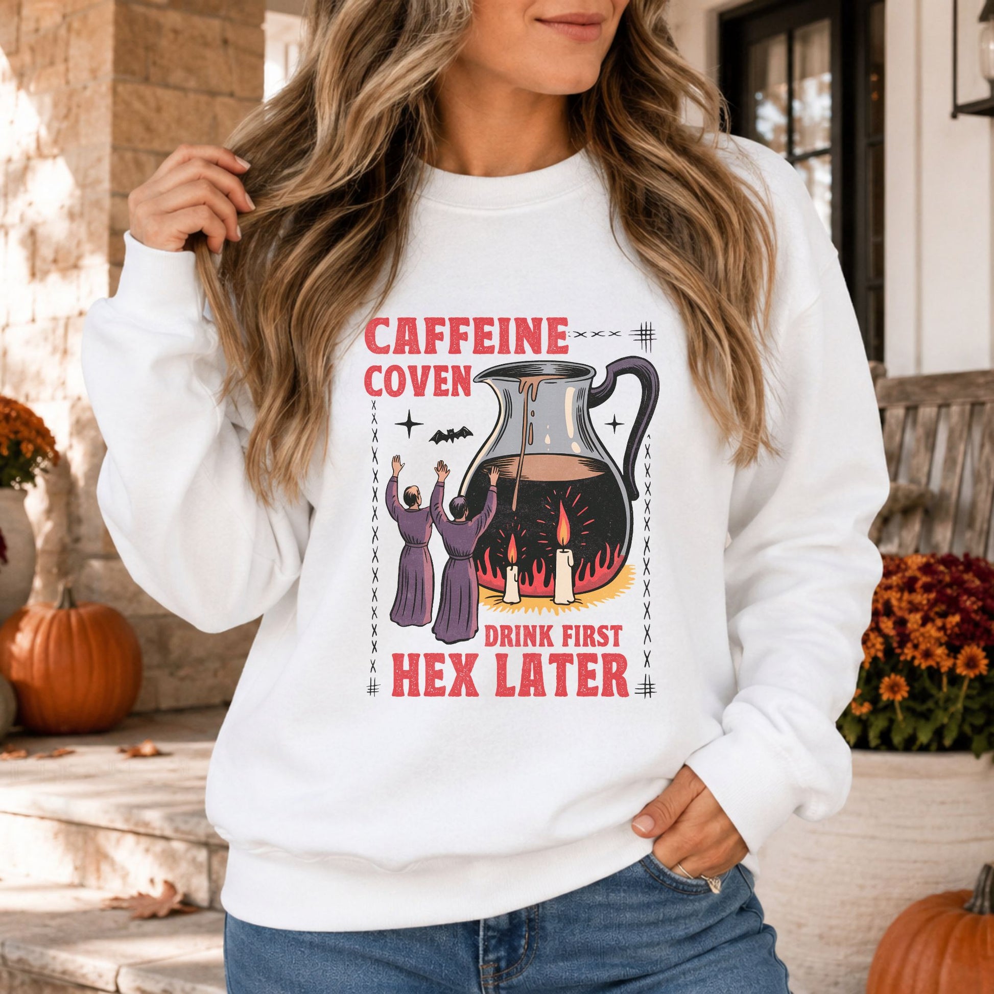 Caffeine Coven Halloween DTF transfer featuring two witches worshipping a giant coffee pitcher over flames and candles with the phrase Drink First, Hex Later, displayed on a white sweatshirt mockup.