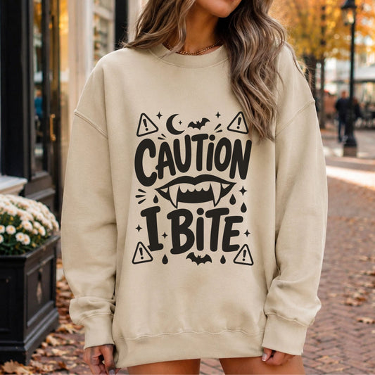 Caution I Bite vampire Halloween DTF transfer with fangs, bats, crescent moon, warning signs and spooky black typography
