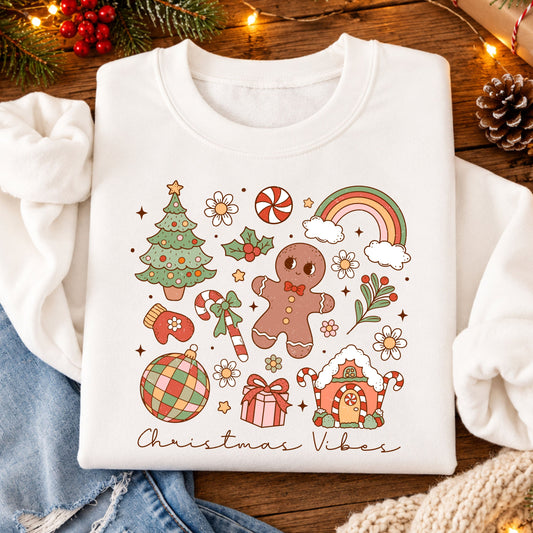Christmas Vibes script beneath a retro collage featuring a gingerbread man and house, Christmas tree, rainbow, disco ornament, candy canes, daisies and a gift in pink, coral, sage and peach.