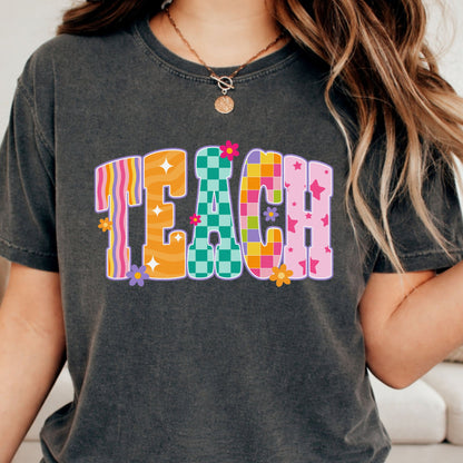 Colorful TEACH DTF transfer featuring mixed retro patterns, checkerboard details, stars, waves, stripes, and small floral accents.