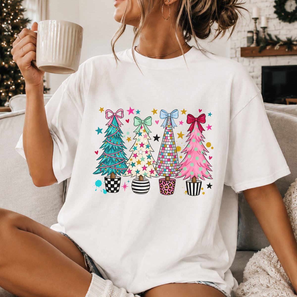 Four Christmas trees topped with bows: teal with lights, cream with stars, colorful disco tiles and pink with mint dots, in checkered, striped and leopard pots.