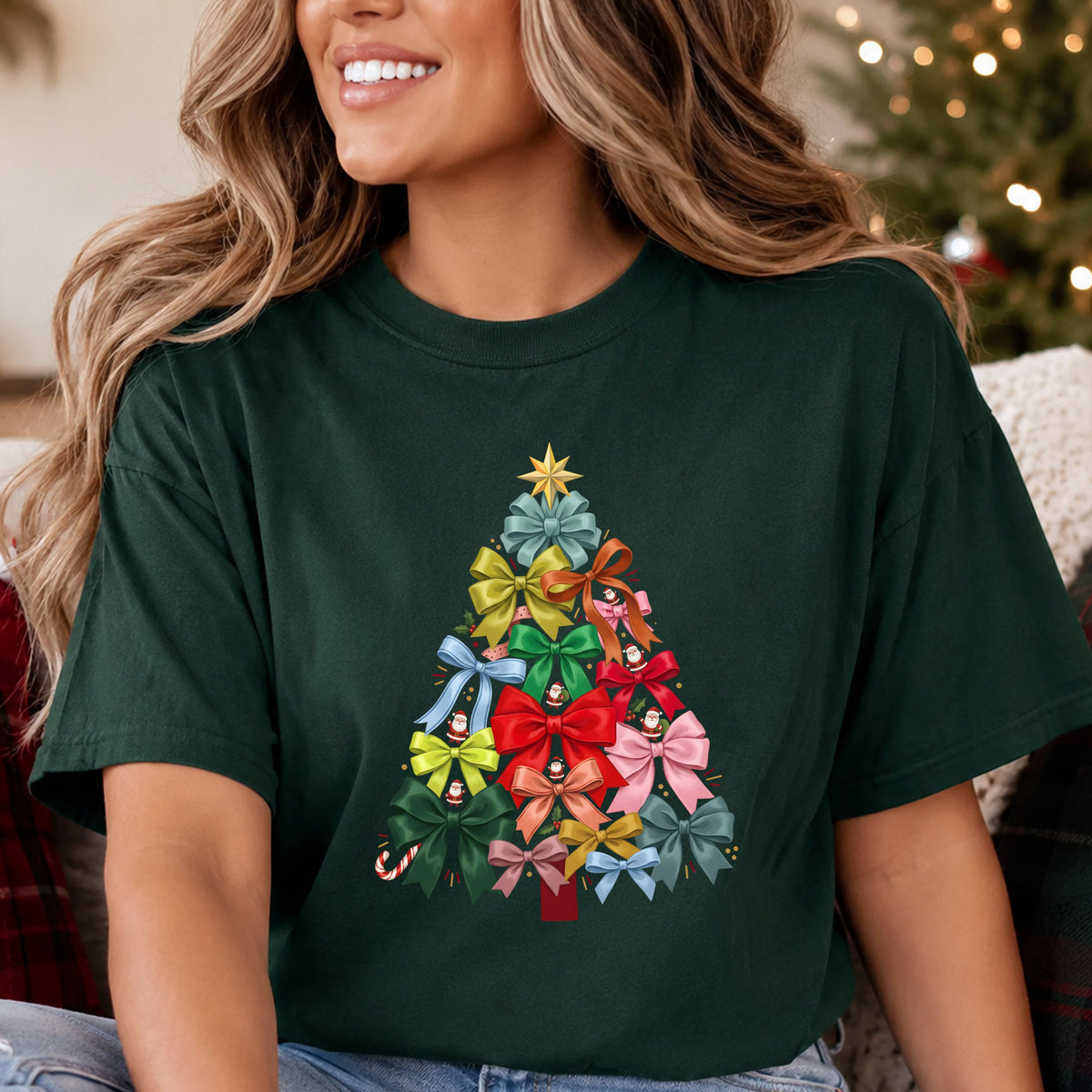 Christmas tree formed from colorful ribbon bows, with miniature Santas, holly, a candy cane, a red trunk and a gold star topper.
