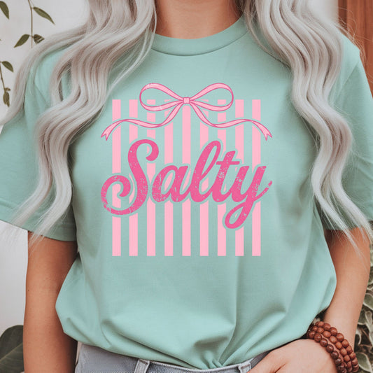 Pink coquette "Salty" graphic featuring a vintage bow and striped background, perfect for preppy graphic tees, hoodies, trendy women's apparel, and cute sarcastic outfits.
