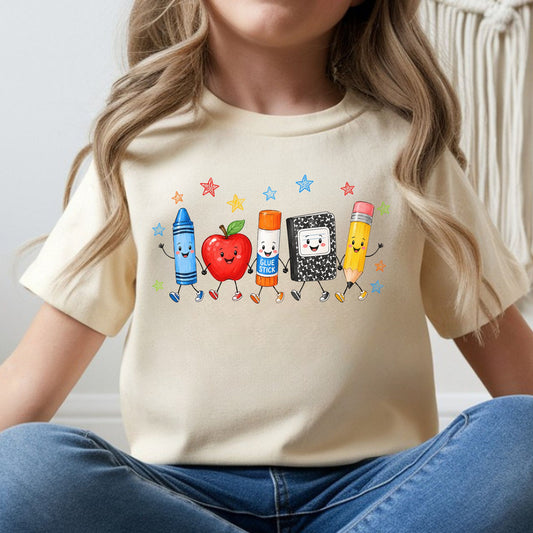 Cute back to school design featuring smiling crayon, apple, glue stick, composition notebook, and pencil characters for toddler, kids, and youth shirts.