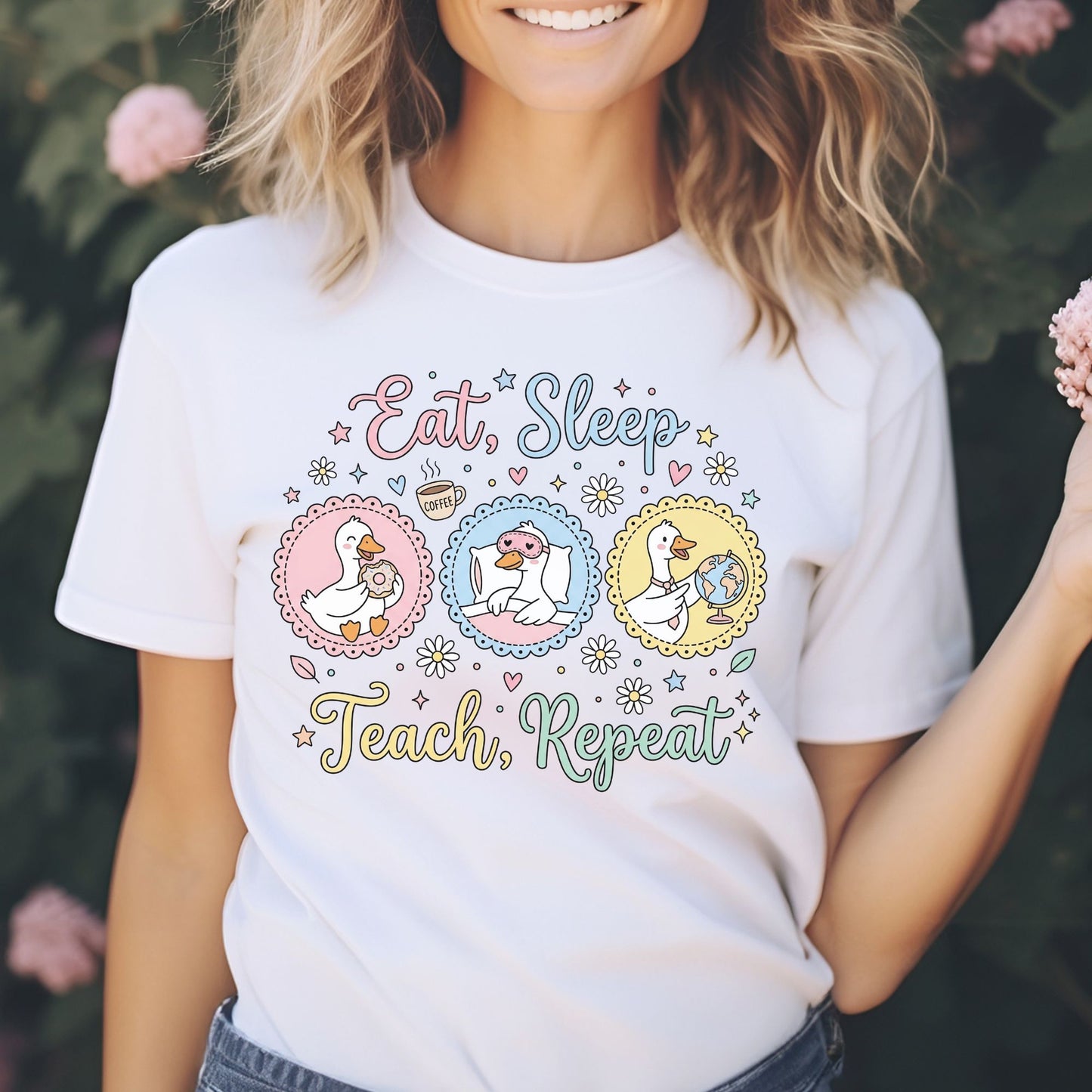 Eat Sleep Teach Repeat teacher design featuring three cute geese with a donut, sleep mask, pillow, coffee mug, globe, daisies, hearts, stars, and soft pastel classroom colors.