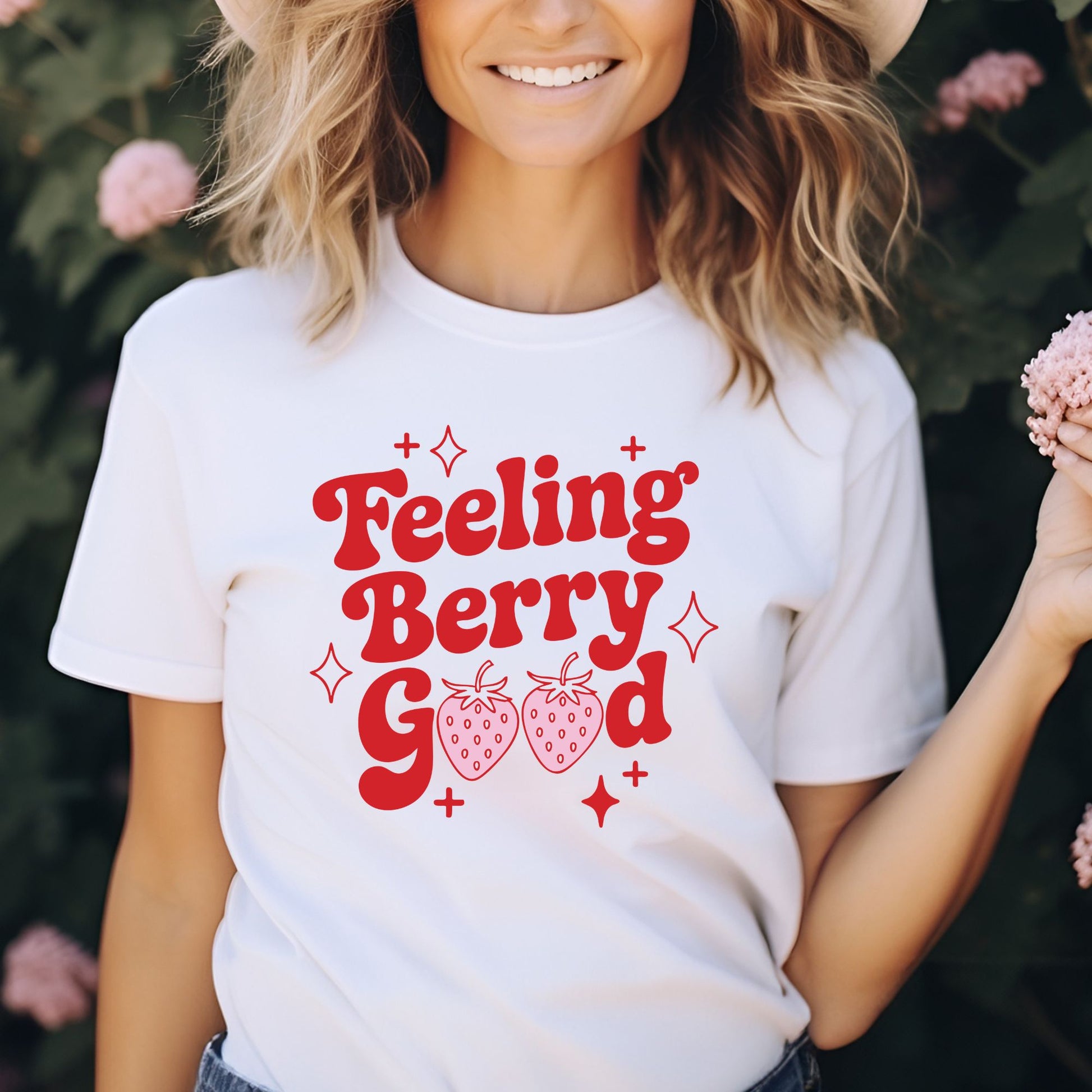 Cute retro strawberry graphic featuring the phrase "Feeling Berry Good" in bold vintage lettering with strawberries and sparkles. Perfect for summer graphic tees, hoodies, fruit lovers, and cottagecore style.
