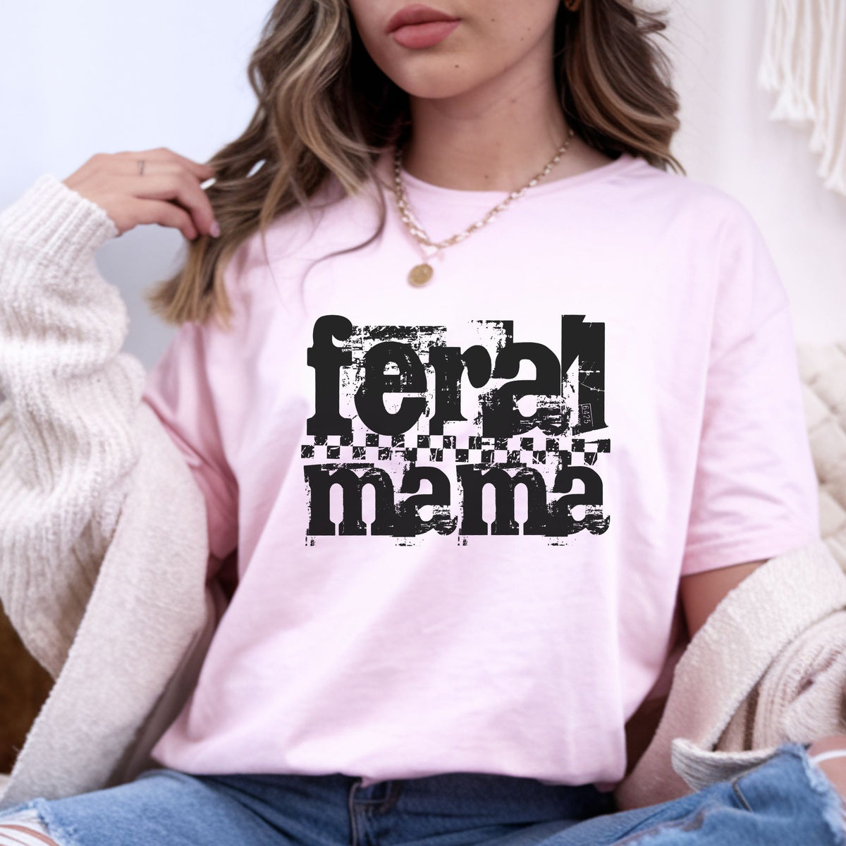 Feral Mama DTF transfer featuring oversized distressed black lettering with grunge texture and a checkerboard stripe, perfect for funny mom shirts, sweatshirts, tote bags, and edgy mama apparel.