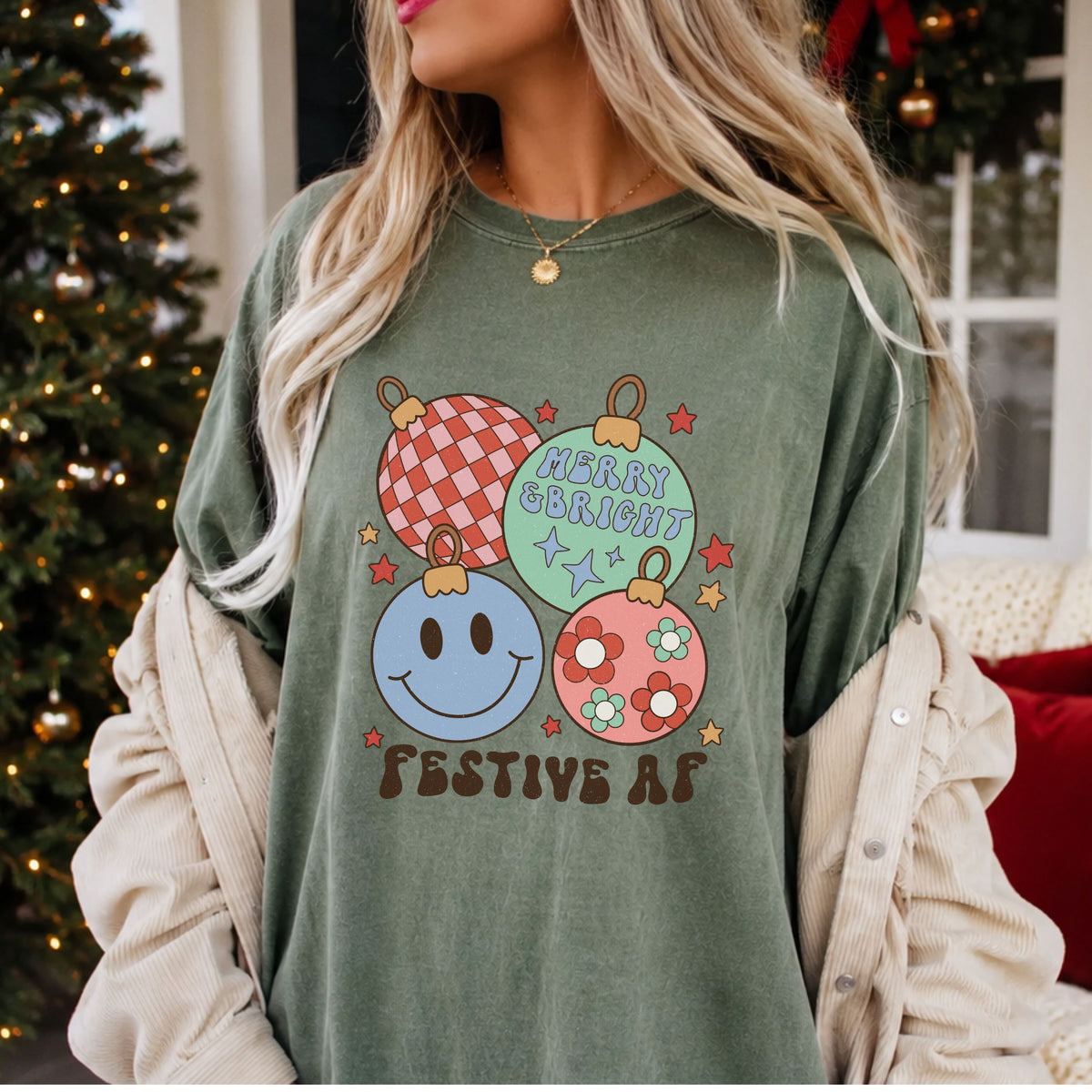 Christmas DTF transfer reading “Festive AF” and “Merry & Bright,” with pastel ornaments featuring pink and red checks, a blue smiley face and daisies.