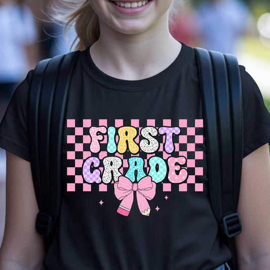 First Grade back-to-school design featuring colorful patterned bubble letters, a pink checkerboard background, pencil bow, sparkles, leopard print, and playful classroom style.