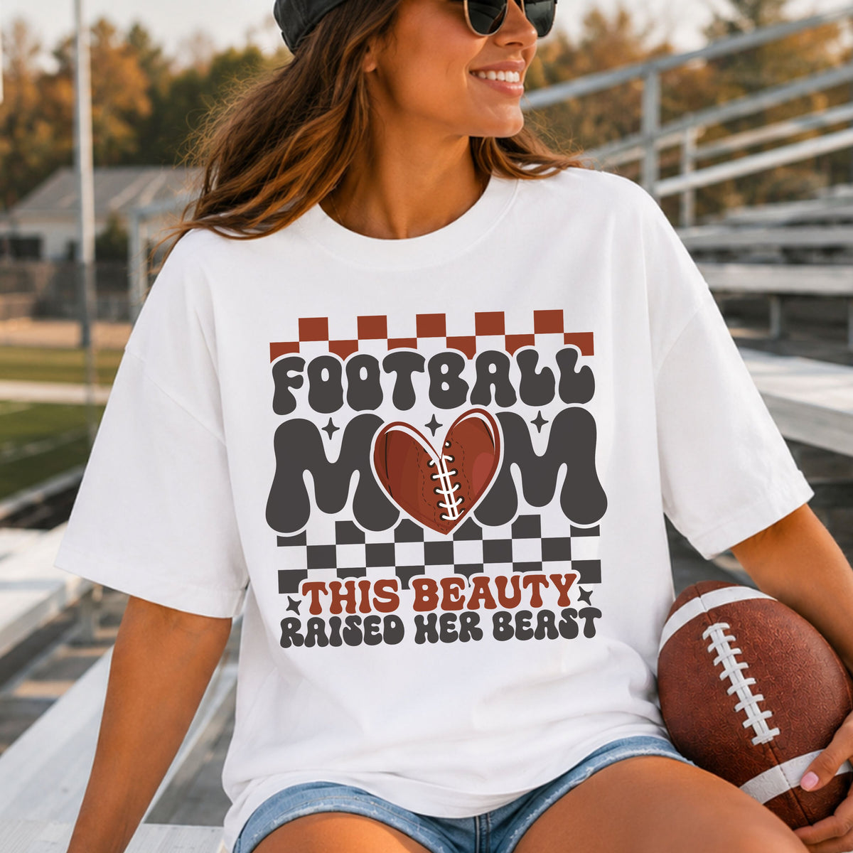 Football Mom DTF transfer featuring This Beauty Raised Her Beast with a football heart, retro checkered pattern, and bold groovy lettering for football mom shirts.