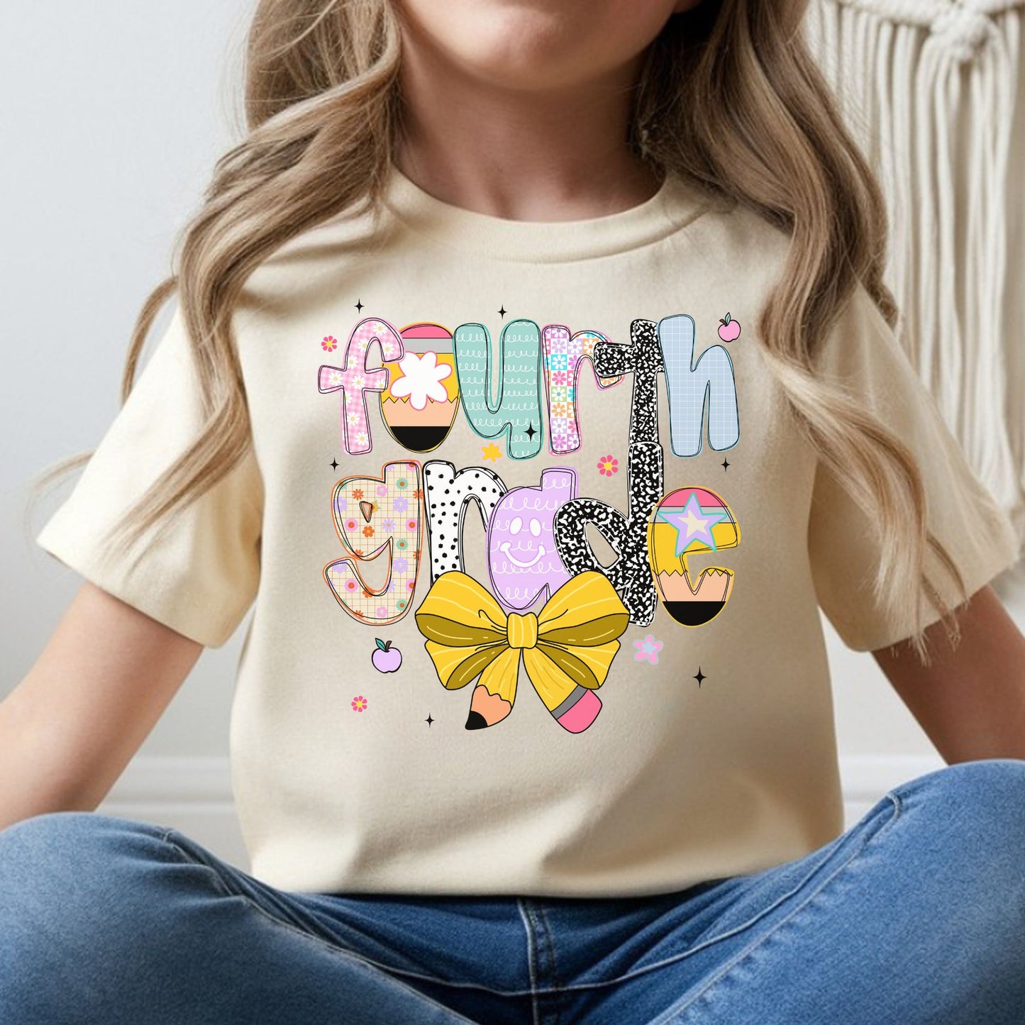 Fourth Grade back-to-school design featuring colorful patterned letters, pencil accents, a yellow pencil bow, flowers, apples, and playful classroom details for kids shirts.