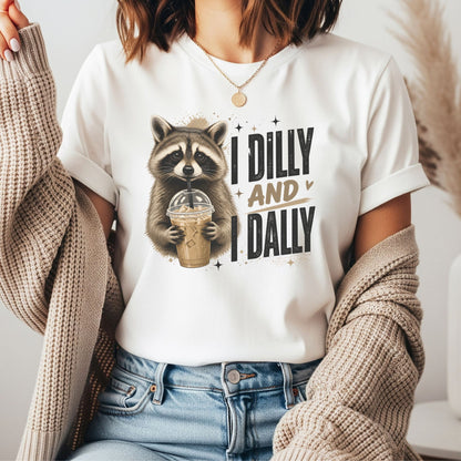 Funny raccoon holding iced coffee graphic with I Dilly And I Dally phrase, coffee lover shirt design, ADHD humor artwork, cute woodland animal graphic