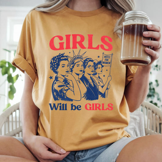Bold feminist graphic featuring vintage women, Rosie-inspired artwork, the Statue of Liberty, and a Votes for Women sign with the phrase "Girls Will Be Girls." Perfect for empowering graphic tees, hoodies, Women's History Month, and girl power apparel.
