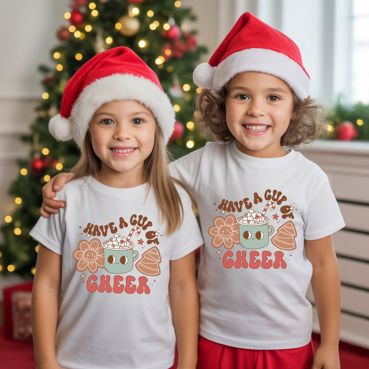 “Have a Cup of Cheer” with a smiling sage green cocoa mug topped with marshmallows and a candy cane, beside a smiley flower cookie and iced Christmas tree cookie.