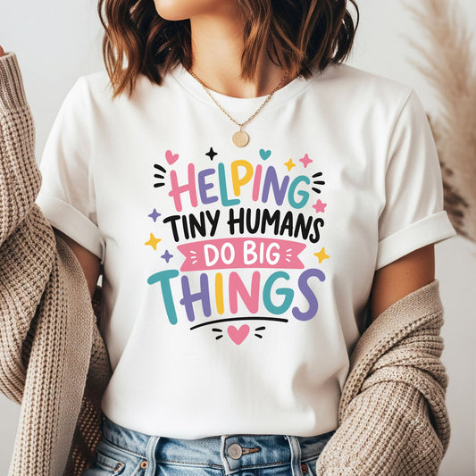 Helping Tiny Humans Do Big Things design featuring bright pink, teal, purple, yellow, and black lettering with hearts, stars, sparkles, and playful classroom accents.