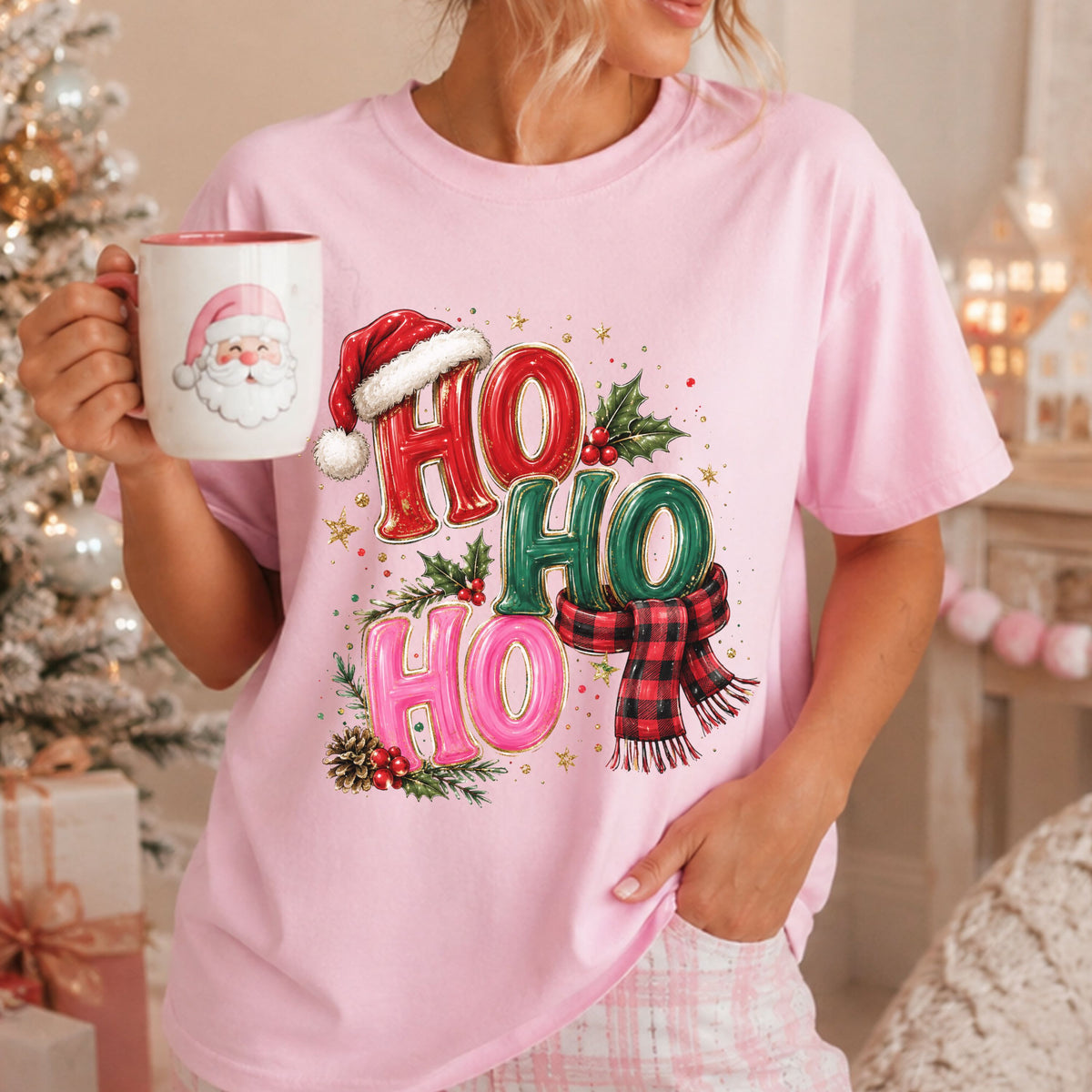 “Ho Ho Ho” in red, green and pink letters with gold outlines, a Santa hat, red and black buffalo plaid scarf, holly, pinecones and gold stars.