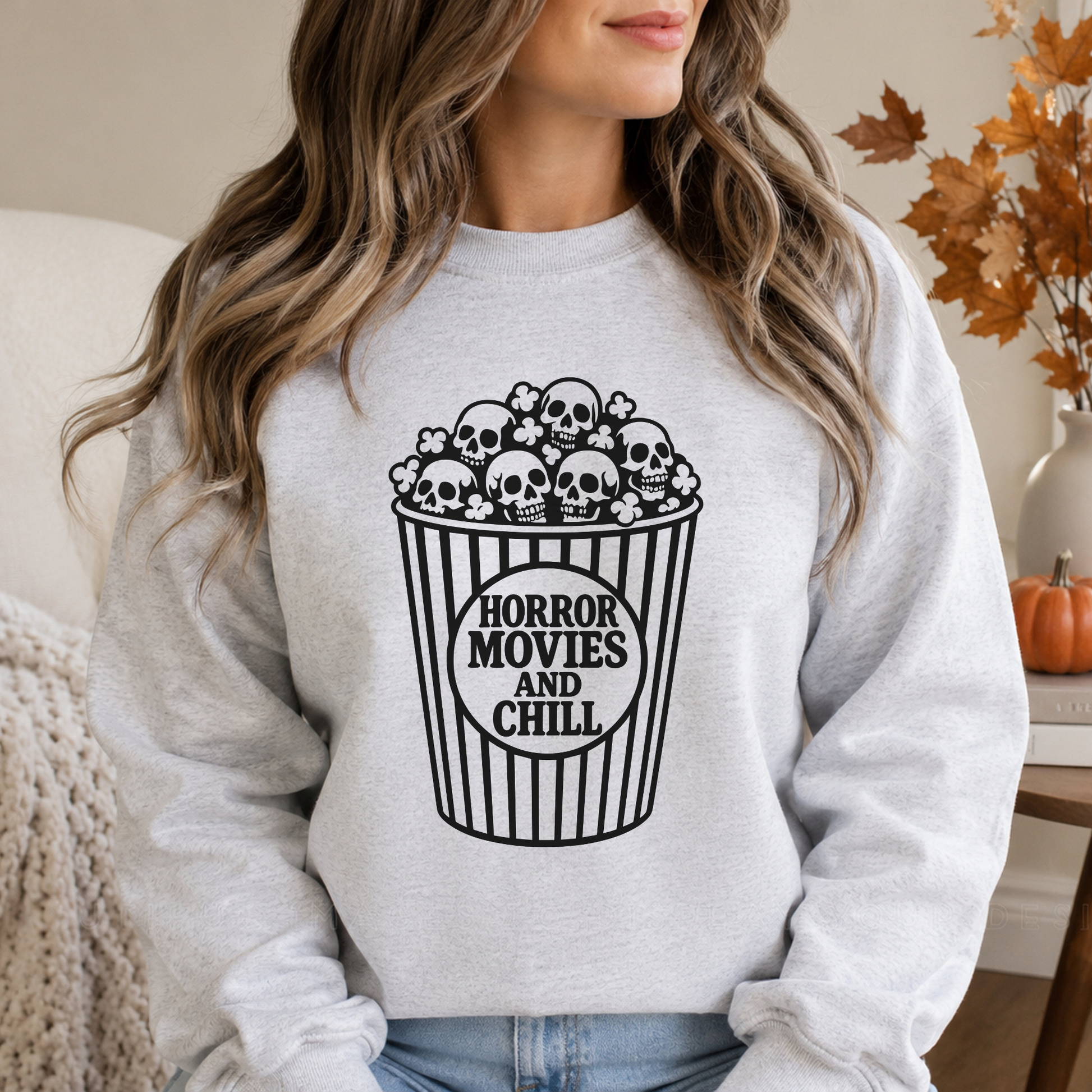 Black-and-white Horror Movies and Chill Halloween DTF transfer featuring a striped movie theater popcorn bucket overflowing with skull-shaped popcorn, displayed on a gray sweatshirt mockup.